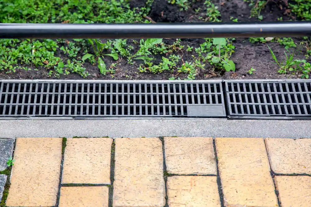 Gray grid of the drainage system for draining rainwater